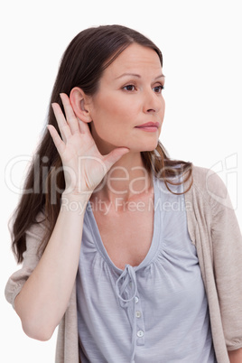 Close up of young woman listening closely