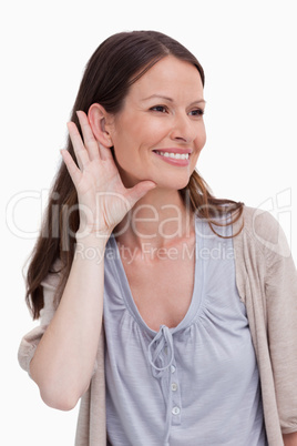 Close up of smiling woman listening closely