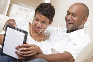 African American Man Woman Couple Using Tablet Computer