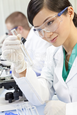 Chinese Female Woman Scientist With Test Tube In Laboratory