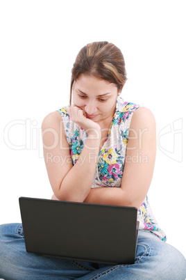 Beautiful young woman sitting on floor with a laptop, isolated o Beautiful young woman sitting on floor with a laptop, isolated o