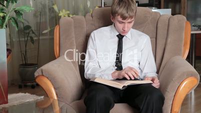 young man prepares for study.