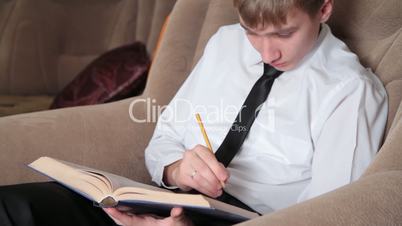 young man prepares for study.