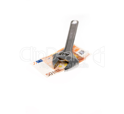 wrench and euro isolated on white