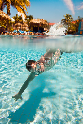 teenager floats in pool