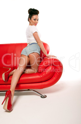 Pert Pinup Girl On Red Sofa