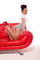Pert Pinup Girl On Red Sofa