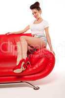 Pert Pinup Girl On Red Sofa
