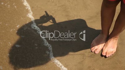 Frau, Beine im Sand