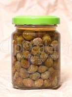 Glass jar with preserved capers
