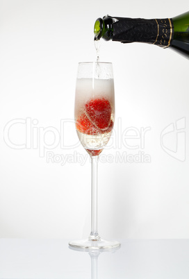 Glasses of sparkling wine and strawberry