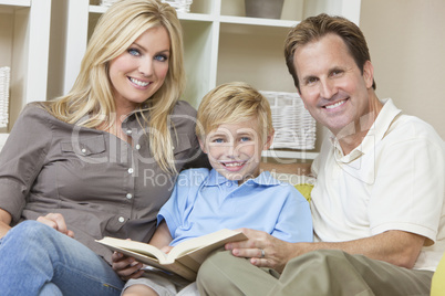 Happy Family Sitting on Sofa Reading A  Book