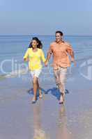 Man & Woman Couple Running on An Empty Beach