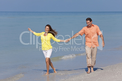 Man & Woman Couple Holding Hands on a Beach