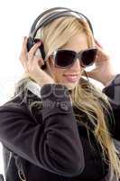 side view of woman holding headphone