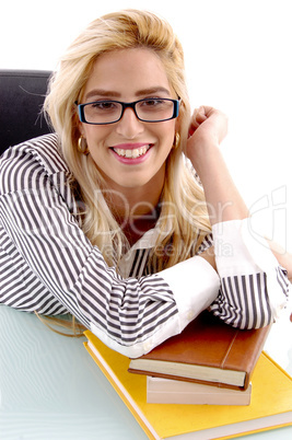 front view of smiling woman with books