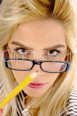 close view of female holding pencil