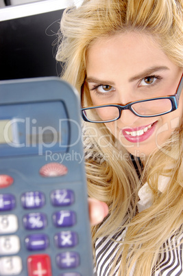 close view of woman showing calculator