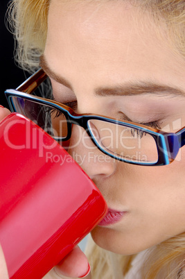 close view of woman drinking coffee