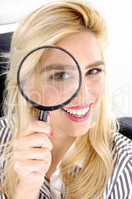 close view of female looking through lens