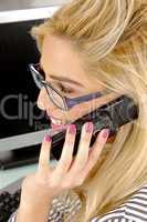 side view of businesswoman talking on mobile
