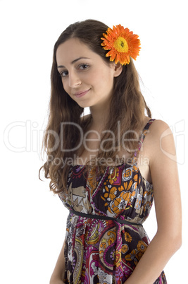 portrait of pretty female with gerbera in hair