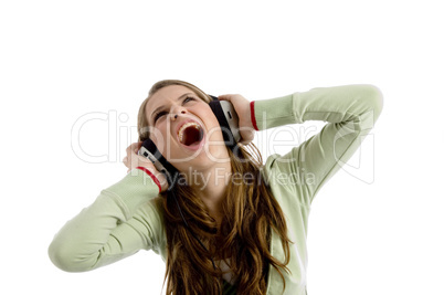 beautiful female rocking on listening music