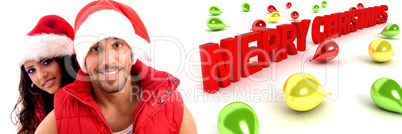 couple wearing christmas hat with balloons