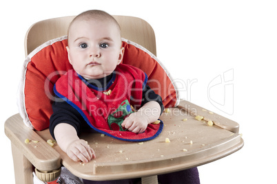 toddler eating potatoes
