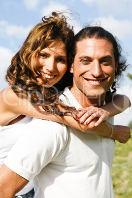 Attractive man carrying woman