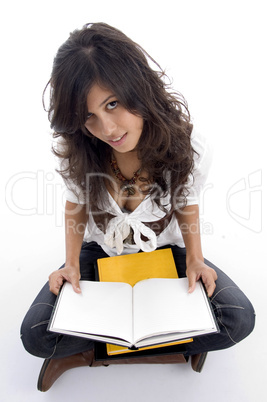 female posing with her opened books