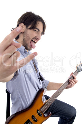 young rock star posing with guitar