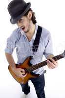 handsome male looking at camera and playing guitar