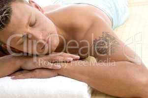 handsome male lying in spa resort