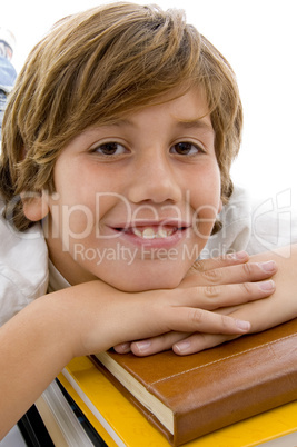 close view of smiling child with books