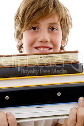 book pile with student holding books