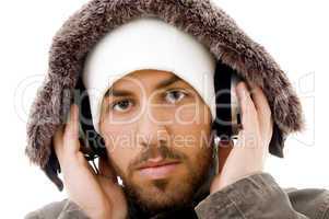 close up of serious male listening  to music in headphone