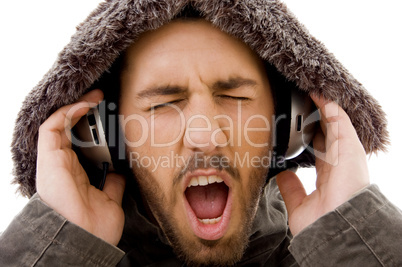 close up of shouting male listening to music