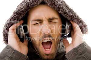 close up of shouting male listening to music