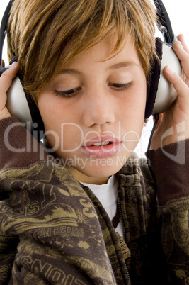 side view of smiling child listening music