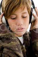side view of smiling child listening music