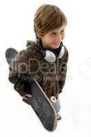 top view of urban kid holding skate