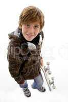 top view of smiling child with skate and headphone