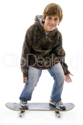 front view of smiling child standing on skate
