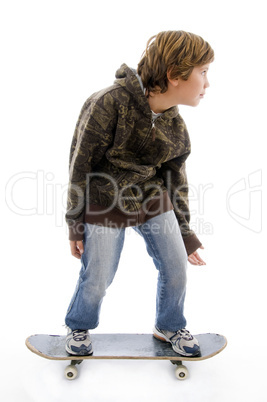 front view of child standing on skateboard