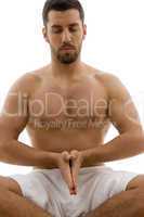 front view of man practicing yoga