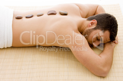 high angle view of man lying down on mat at spa