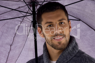 front view of man holding umbrella