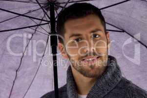 front view of man holding umbrella