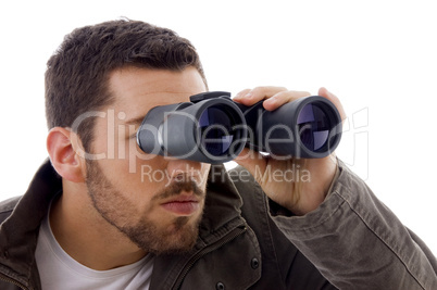 side view of man looking through binoculars
